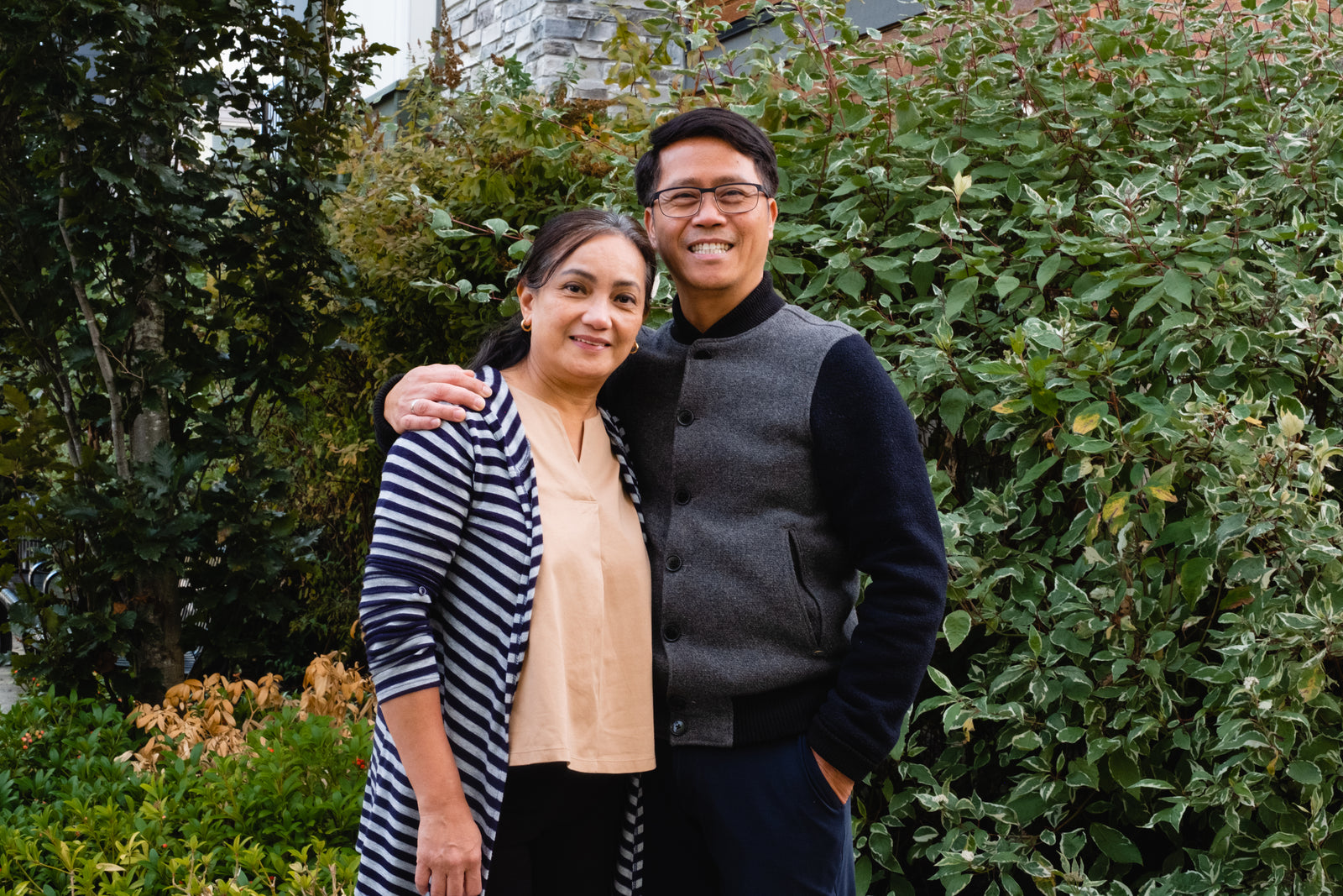 A couple laughing together in a garden